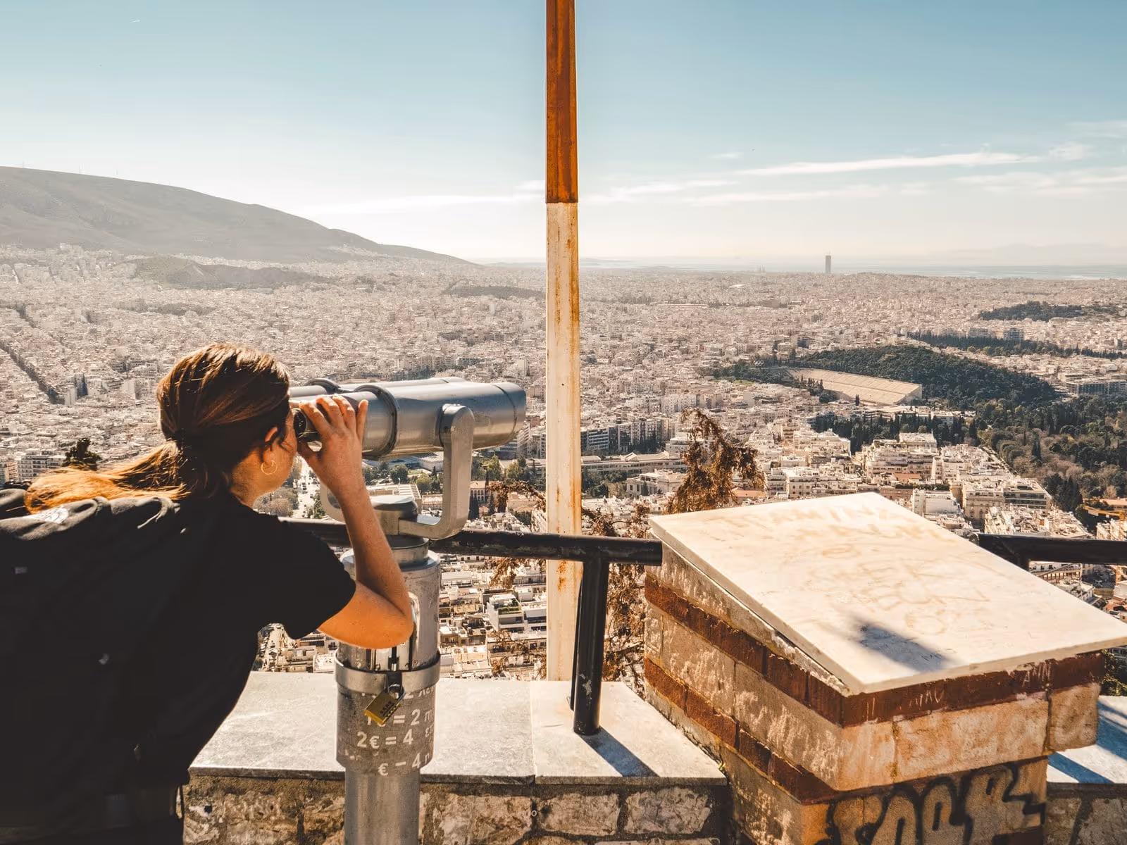 Friends at sunset on a Lycabettus Hill viewpoint capturing Athens photography content